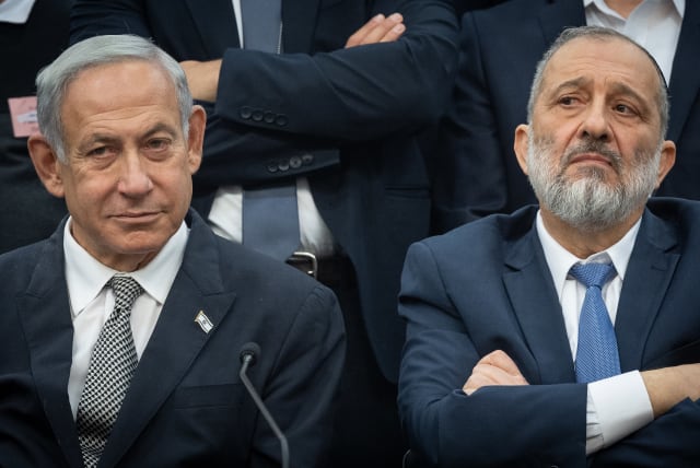  Shas leader MK Aryeh Deri and Israeli prime minister Benjamin Netanyahu seen during a Shas party meeting, at the Knesset, the Israeli parliament in Jerusalem, on January 23, 2023. (photo credit: YONATAN SINDEL/FLASH90)