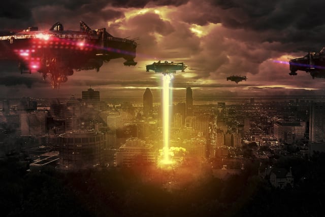  Alien UFOs are seen attacking a city on Earth in this illustrative image. (photo credit: PIXABAY)