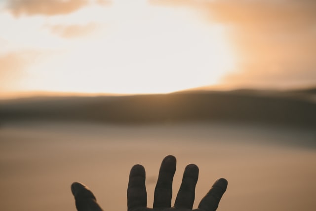  THE TORAH refers to Moshe’s hands as ‘hands of faith.’ (photo credit: Billy Pasco/Unsplash)