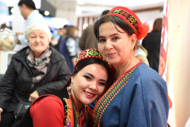  Uzbeks deliver a warm welcome. A stand at the Tashkent International Tourism Fair 2022  (photo credit: @MarkDavidPod   )