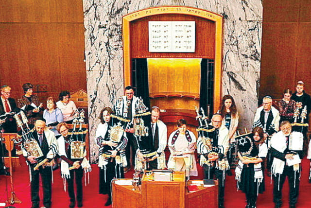  All the Torah scrolls are removed from the ark during the deconsecration service.  (photo credit: Simon Marcus/Addictive Media)