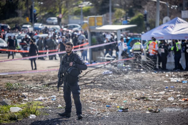  Rescue and Police at the scene of the deadly car-ramming attack near the Ramot junction, in Jerusalem on February 10, 2023. (photo credit: YONATAN SINDEL/FLASH90)