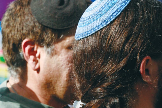  MEN WEARING  kippot attend the Pride Parade in Jerusalem. (photo credit: OLIVIER FITOUSSI/FLASH90)