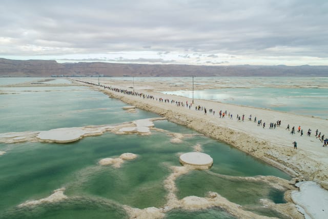  PARTICIPANTS IN THE Dead Sea Marathon on February 3 pass spectacular scenery  as they cross the rampart connecting Israel and Jordan. (photo credit: ELEMENTS)