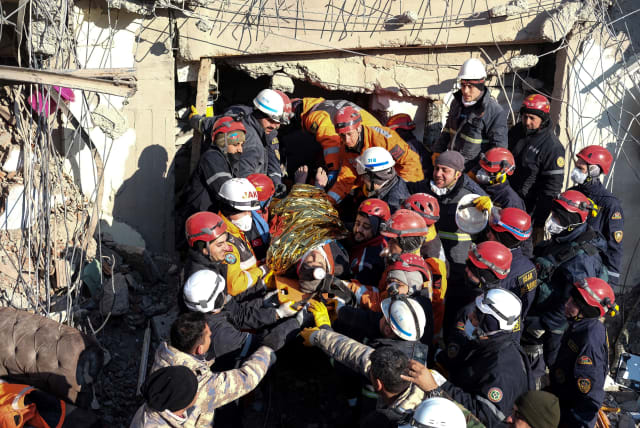  Muhammed Enes Yeninar, a 17-year-old earthquake survivor, is rescued from the rubble of a building some 198 hours after last week's devastating earthquake, in Adiyaman, Turkey February 14, 2023 (photo credit: Ismail Coskun/Ihlas News Agency (IHA) via REUTERS)