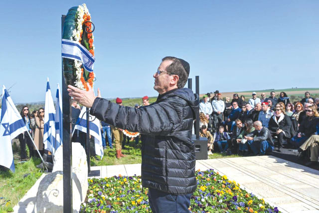  PRESIDENT ISAAC HERZOG places a wreath during the memorial ceremony for prime minister Ariel Sharon.  (photo credit: Gregory Bado)