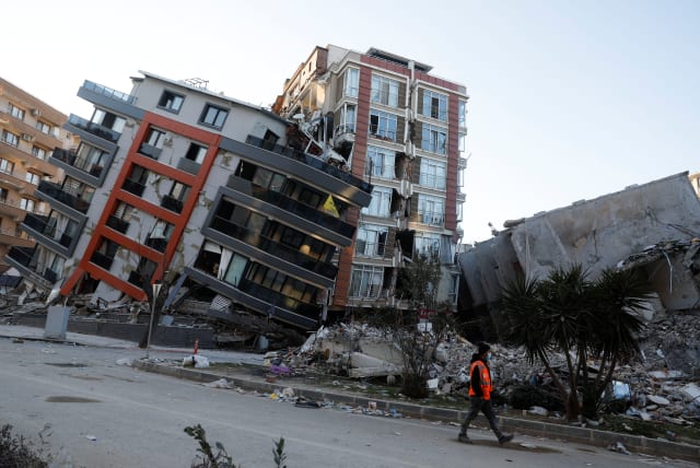  A view shows semi collapsed buildings in the aftermath of a deadly earthquake in Hatay, Turkey February 15, 2023. (photo credit: CLODAGH KILCOYNE/REUTERS)