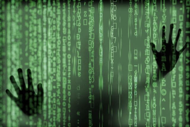  Hands are seen interfering with cyber code (Illustrative). (photo credit: PIXABAY)