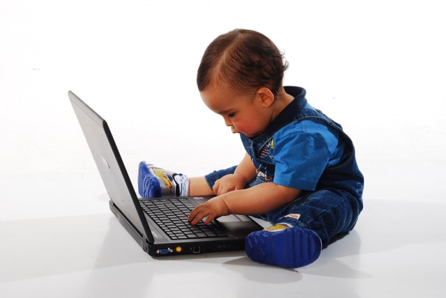 Toddler using a laptop (illustrative) (photo credit: PUBLICDOMAINPICTURES.NET)