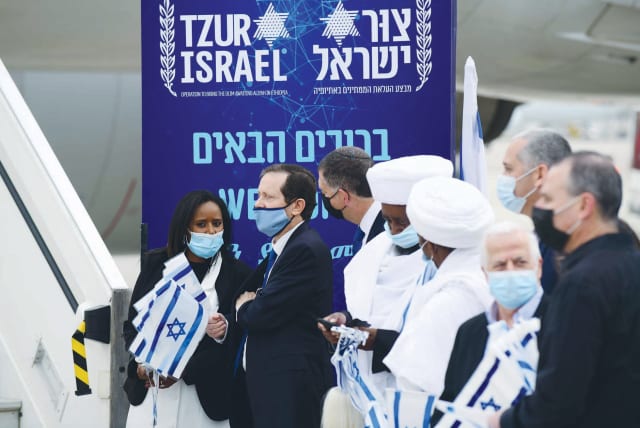  THEN-ALIYAH and integration minister Pnina Tamano-Shata and then-Jewish Agency chair Isaac Herzog arrive at Ben-Gurion Airport, to welcome new immigrants arriving in the Tzur Israel operation bringing olim from Ethiopia, in 2021. (photo credit: TOMER NEUBERG/FLASH90)