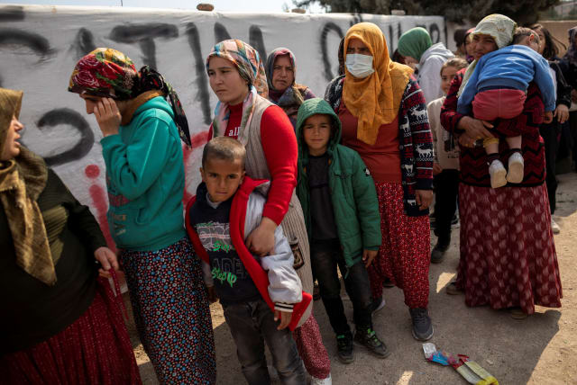 People affected by the deadly earthquake queue for aid in Hatay, Turkey, February 24, 2023. (photo credit: REUTERS/ELOISA LOPEZ)