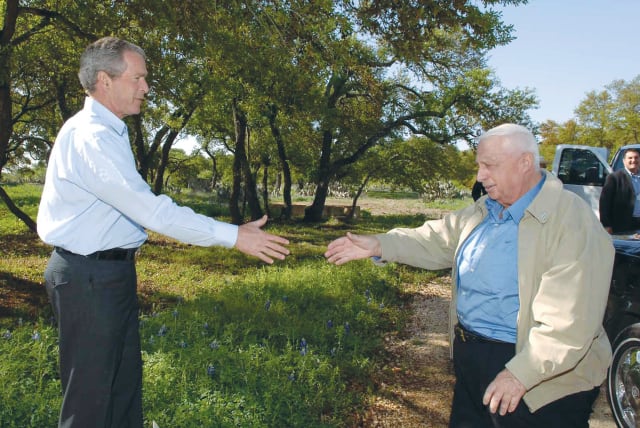  THEN-US president George W. Bush welcomes then-prime minister Ariel Sharon to the presidential ranch in Crawford, Texas, in 2005.  (photo credit: Avi Ohayon/GPO)