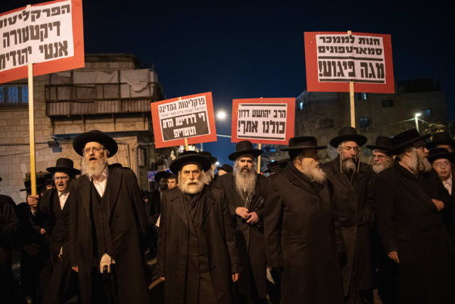  Ultra-Orthodox Jewish men protest against the arrest of an ultra orthodox man, in Jerusalem, on February 21, 2023. (photo credit: ERIK MARMOR/FLASH90)