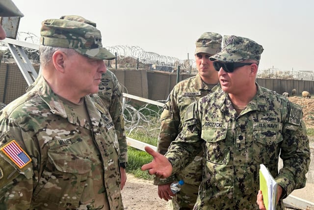  US Joint Chiefs Chair Army General Mark Milley speaks with US forces in Syria during an unannounced visit, at a US military base in Northeast Syria, March 4, 2023.  (photo credit: REUTERS/PHIL STEWART)