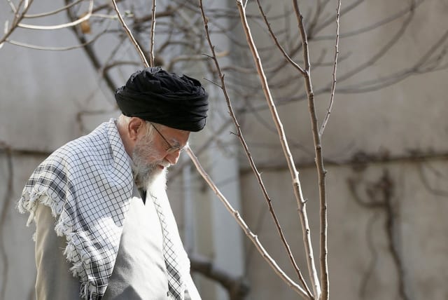  UNDETERRED: IRANIAN Supreme Leader Ayatollah Ali Khamenei waters a sapling during Tehran’s Arbor Day ceremony, March 6. (photo credit: Office of the Iranian Supreme Leader/WANA/Handout via Reuters)