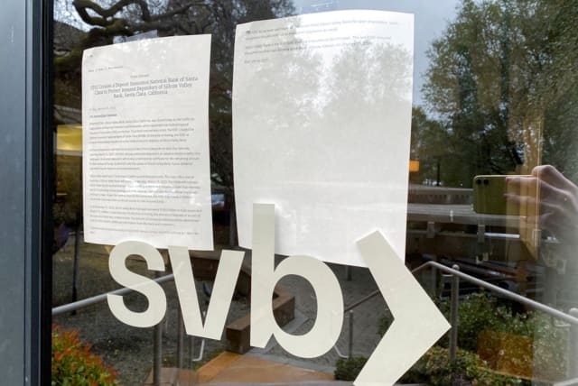   A locked door to a Silicon Valley Bank (SVB) location on Sand Hill Road is seen in Menlo Park, California, US March 10, 2023.  (photo credit: REUTERS/JEFFREY DASTIN/FILE PHOTO)