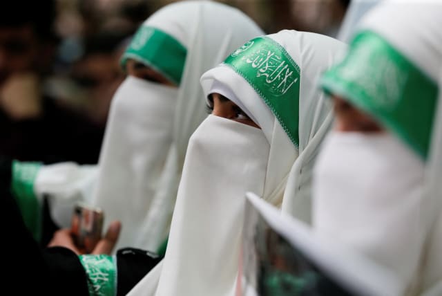  Palestinian students supporting Hamas take part in an election campaign for students' council at Palestine Polytechnic University in Hebron, in the Israeli-occupied West Bank March 13, 2023.  (photo credit: REUTERS/MUSSA QAWASMA)