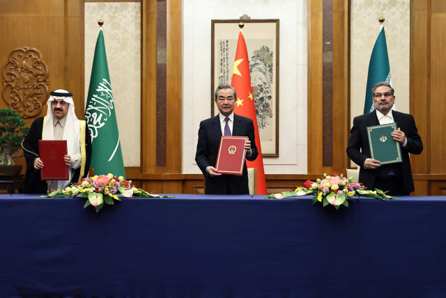  Wang Yi, a member of the Political Bureau of the Communist Party of China (CPC) Central Committee and director of the Office of the Central Foreign Affairs Commission attends a meeting with Secretary of Iran's Supreme National Security Council Ali Shamkhani and Minister of State and national secur (photo credit: CHINA DAILY VIA REUTERS)