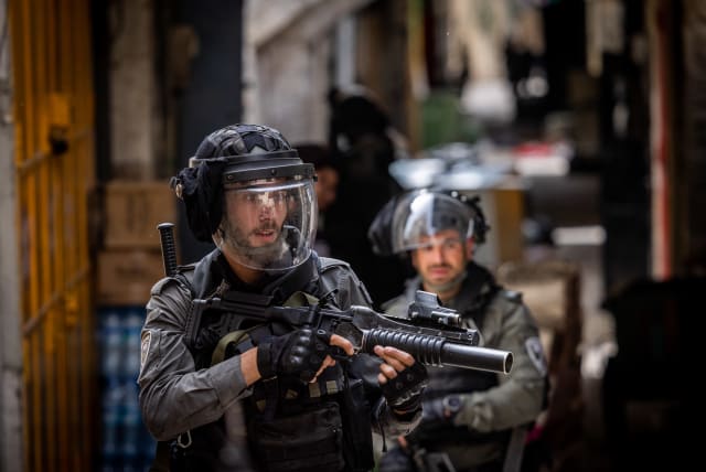  Israeli police officers during clashes outside the Al Aqsa Mosque, in Jerusalem's Old City on April 17, 2022.  (photo credit: YONATAN SINDEL/FLASH90)