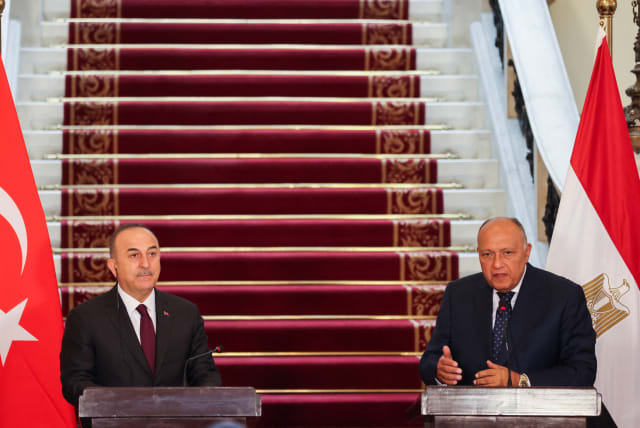  Turkish Foreign Minister Mevlut Cavusoglu and Egyptian Foreign Minister Sameh Shoukry attend a news conference in Cairo, Egypt March 18, 2023. (photo credit: REUTERS/MOHAMED ABD EL GHANY)