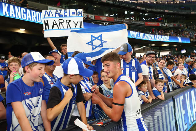  Israeli flags and signs shown at AFL games in support of Harry Sheezel. (photo credit: PETER HASKIN/AUSTRALIAN JEWISH NEWS)