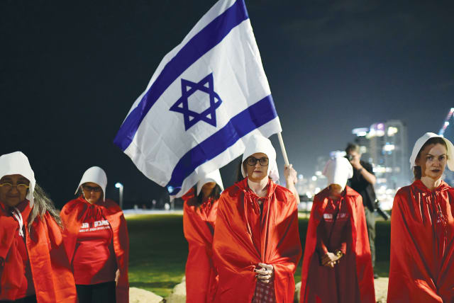 PROTESTERS DRESS as characters from ‘The Handmaid’s Tale,’ to show their opposition to the government’s planned judicial overhaul, in Tel Aviv, earlier this month.  (photo credit: TOMER NEUBERG/FLASH90)