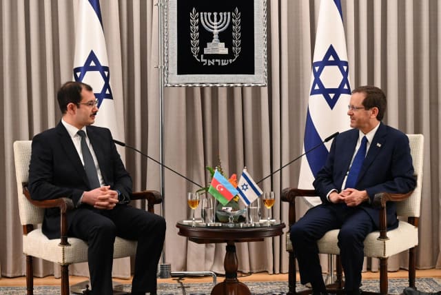 Azerbaijan's ambassador to Israel, Mukhtar Mammadov, presents his credentials to President Isaac Herzog on March 26, 2023. (photo credit: CHAIM TZACH/GPO)