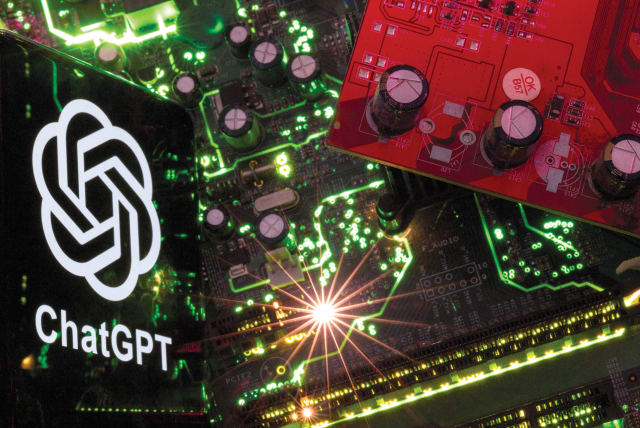  A smartphone with a displayed ChatGPT logo is placed on a computer motherboard in this illustration taken February 23, 2023.  (photo credit: DADO RUVIC/REUTERS)