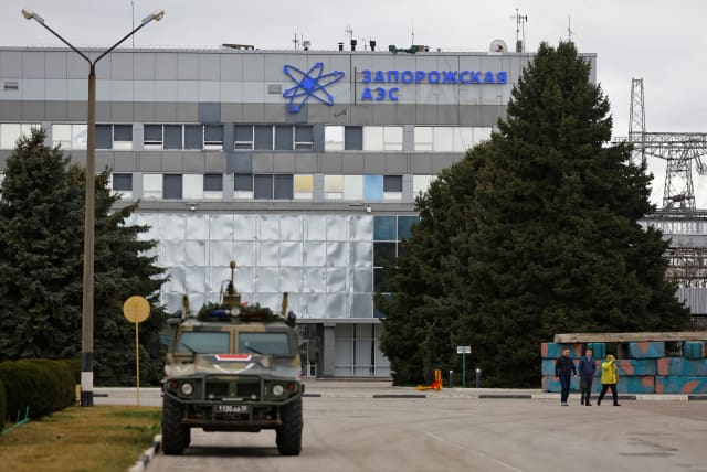  A Russian military vehicle is parked outside the Zaporizhzhia Nuclear Power Plant during a visit of the International Atomic Energy Agency (IAEA) expert mission in the course of Russia-Ukraine conflict outside Enerhodar in the Zaporizhzhia region, Russian-controlled Ukraine, March 29, 2023. (photo credit: REUTERS/ALEXANDER ERMOCHENKO)
