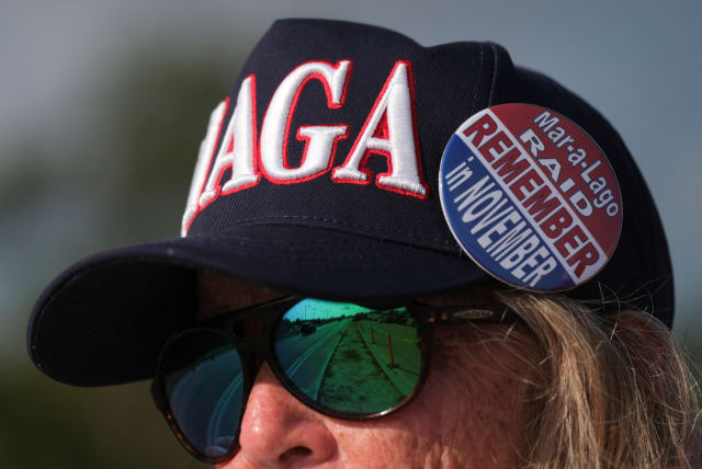  A supporter of former US President Donald Trump is pictured outside his Mar-a-Lago resort after he was indicted by a Manhattan grand jury following a probe into hush money paid to porn star Stormy Daniels, in Palm Beach, Florida, US, April 3, 2023.  (photo credit: REUTERS/RICARDO ARDUENGO)