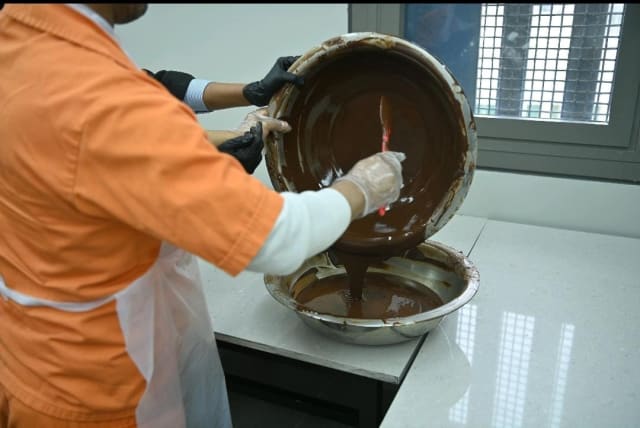 Israeli inmates work at the Magen Nitzan Prison chocolate factory. (photo credit: ISRAEL PRISON SERVICE)