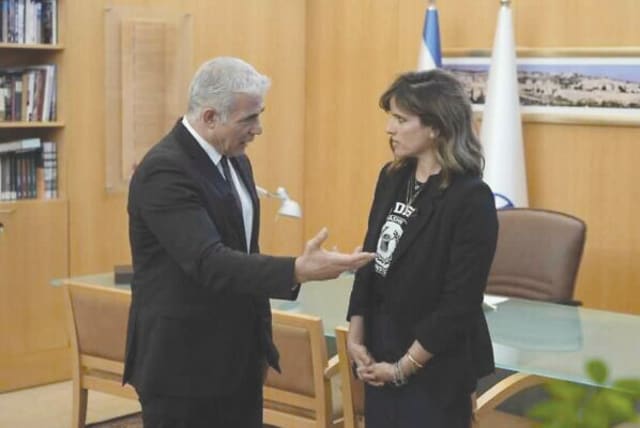  THEN-FOREIGN MINISTER Yair Lapid greets Noa Tishby after her appointment as special envoy to combat antisemitism and delegitimization, last April in Jerusalem. (photo credit: FOREIGN MINISTRY)