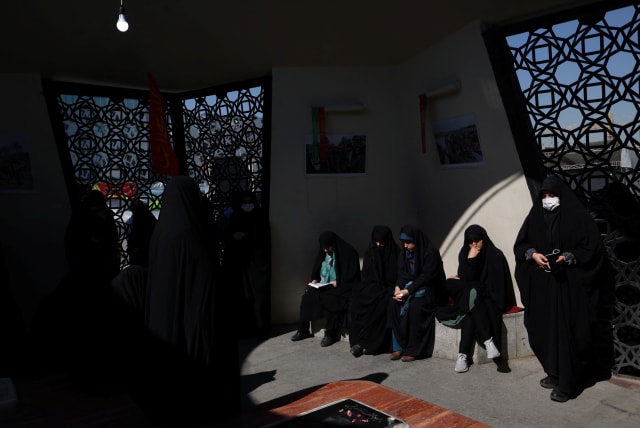  Iranian women gather during the funeral ceremony of Milad Heydari and Meghdad Mahghani, members of Iran's Islamic Revolution Guards Corps (IRGC) who were killed in an Israeli airstrike on Damascus, held in Tehran, Iran, April 4, 2023. (photo credit: Majid Asgaripour/WANA/via Reuters)