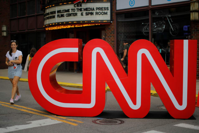  The CNN logo stands outside the venue of the second Democratic 2020 U.S. presidential candidates debate, in the Fox Theater in Detroit, Michigan, US, July 30, 2019.  (photo credit: REUTERS/BRIAN SNYDER)