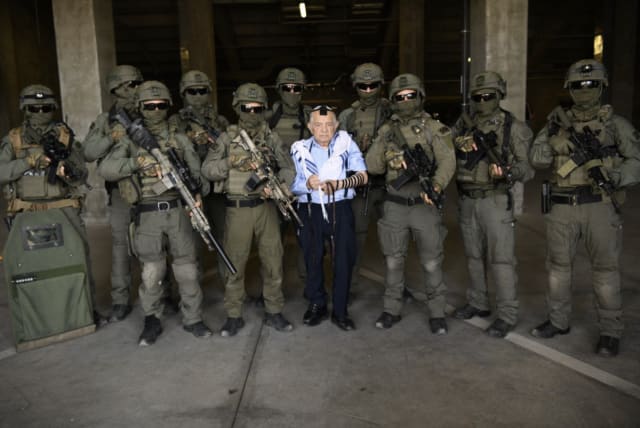  Jerusalem Border Police pose for a photo with their adopted Holocaust survivor, Ezekiel  (photo credit: ISRAEL POLICE SPOKESPERSON'S UNIT)