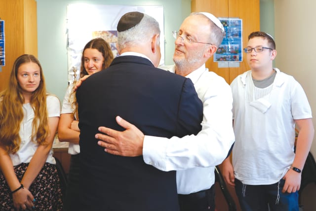  RABBI LEO Dee embraces Prime Minister Benjamin Netanyahu at the Dee family shiva at their home in Efrat, on Sunday.  (photo credit: GERSHON ELINSON/FLASH90)