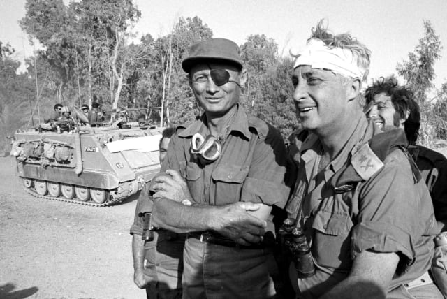  THEN-DEFENSE minister Moshe Dayan surveys the western side of the Suez Canal with Maj.-Gen. Ariel Sharon, in October 1973. When Egypt and Syria surprised Israel on Yom Kippur, Dayan feared destruction.  (photo credit: DEFENSE MINISTRY)
