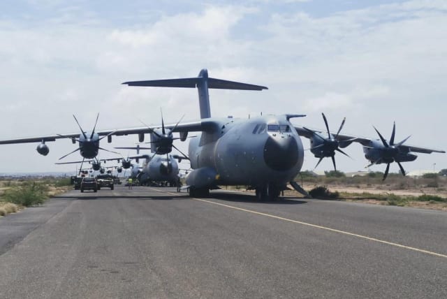  Spanish military plane and military vehicles are seen departing on tarmac as Spanish diplomatic personnel and citizens are evacuated, in Khartoum, Sudan, April 23, 2023. (photo credit: SPANISH DEFENCE MINISTRY HANDOUT/REUTERS)