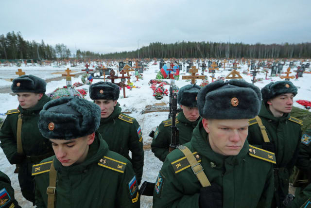  Cadets of a military academy attend the funeral of Dmitry Menshikov, a mercenary for the private Russian military company Wagner Group, killed during the military conflict in Ukraine, in the Alley of Heroes at a cemetery in Saint Petersburg, Russia December 24, 2022. (photo credit: REUTERS/IGOR RUSSAK)