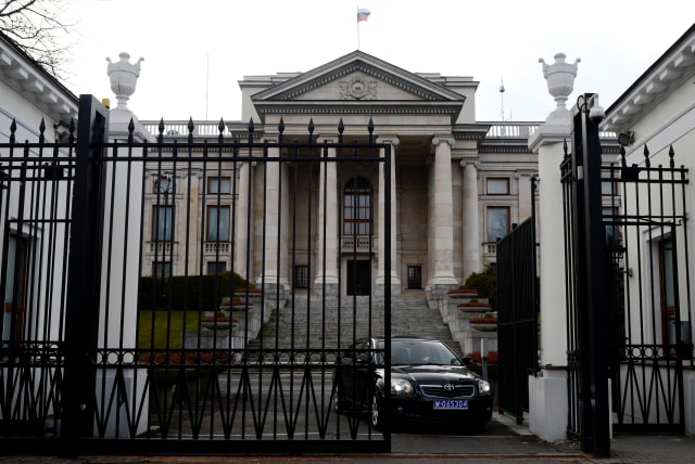  A car leaves through the gate of the Russian embassy building in Warsaw, Poland March 26, 2018. (photo credit: REUTERS/KACPER PEMPEL)