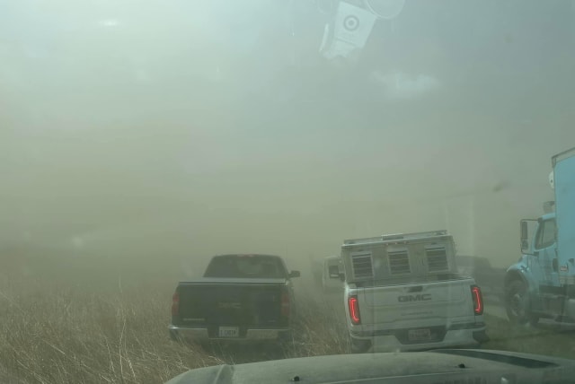  A view of vehicles in a dust storm, which cut visibility to near zero and triggered a series of chain-reaction crashes involving dozens of vehicles, on a highway in Springfield, Illinois, U.S. May 1, 2023 in this picture obtained from social media. (photo credit: Thomas DeVore via TMX/via REUTERS)