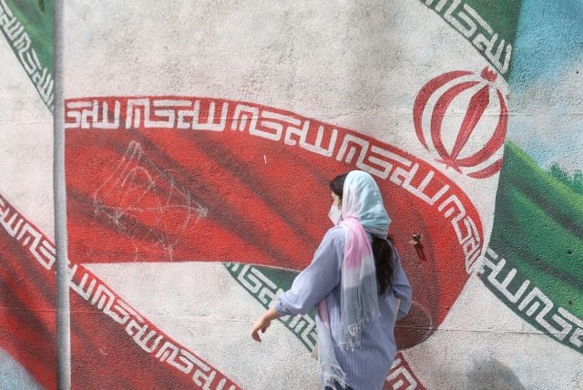  An Iranian woman walks in a street in Tehran, Iran, April 9, 2023. (photo credit: MAJID ASGARIPOUR/WANA/REUTERS)