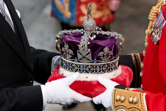  THE IMPERIAL State Crown – used to coronate Queen Elizabeth II – arrives ahead of the 2022 State Opening of Parliament in London.  (photo credit: Chris Jackson/Pool/Reuters)