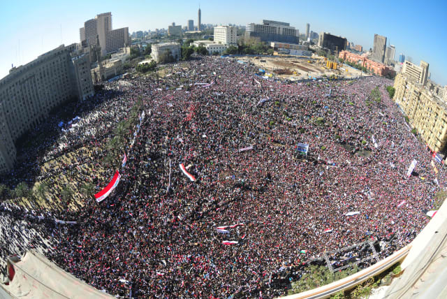  MODERN-DAY ‘coup’: Egyptian pro-democracy supporters gather in Cairo’s Tahrir Square in 2011, during the Arab Spring.  (photo credit: Mohamed Abd El-Ghany/File/Reuters)