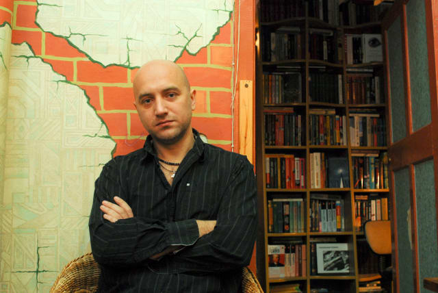  Russian writer Zakhar Prilepin poses for a picture in his flat in Nizhny Novgorod, Russia, December 6, 2008. (photo credit: REUTERS/Mikhail Beznosov)