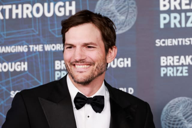  Ashton Kutcher arrives for the Ninth Breakthrough Prize Ceremony at the Academy Museum of Motion Pictures in Los Angeles, California, US, April 15, 2023. (photo credit: REUTERS/AUDE GUERRUCCI)