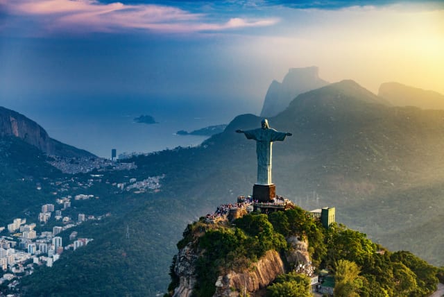  Christ The Redeemer statue in Rio De Janeiro. Sunset, shot from the helicopter (photo credit: INGIMAGE)