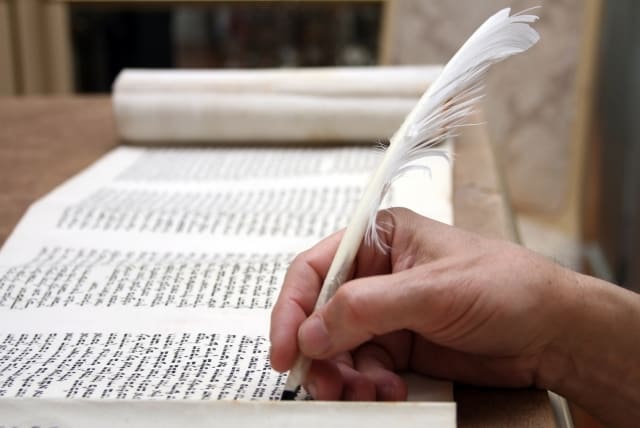  A Torah scroll being written. (photo credit: GETTY IMAGES/JTA)
