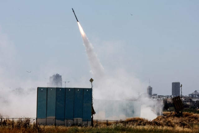  An Israeli Iron Dome anti-missile system is activated as rockets launched from the Gaza Strip, near Ashdod, Israel May 10, 2023 (photo credit: REUTERS/AMMAR AWAD)