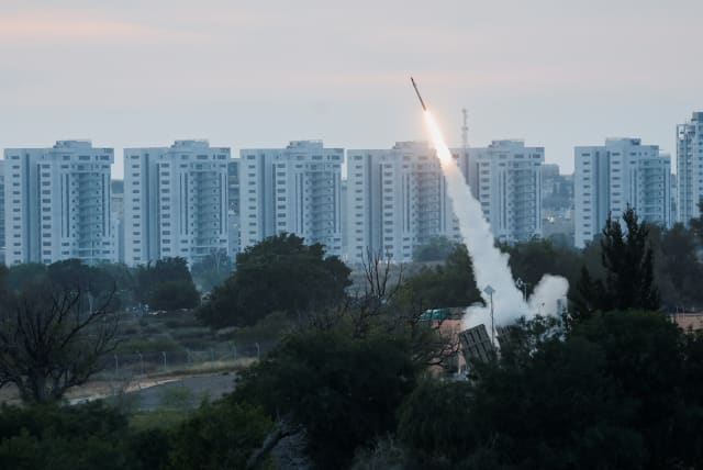  An Iron Dome launcher fires an interceptor missile as rockets are fired from Gaza, in Ashkelon, Israel May 10, 2023 (photo credit: REUTERS/AMIR COHEN)
